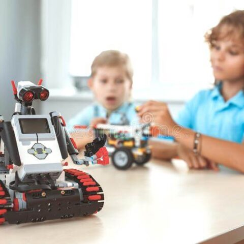 robotics-children-having-class-making-machine-concentrated-blurred-robot-close-up-children-having-robotics-class-making-machine-158281320 (1)